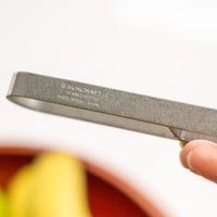 This medium version of the Julienne peeler, SSK-13, from Japanese manufacturer Suncraft is made of very sharp, precise, and thin stainless steel.  A Julienne peeler is a quick and safe tool for making thin julienne strips of vegetables, especially harder veggies like carrots, zucchini, potatoes, sweet potatoes, etc. Great for making garnishes, salad toppings, stir-fries, potato hash browns, citrus zest, and more.  Total length: 190mm (7.5")