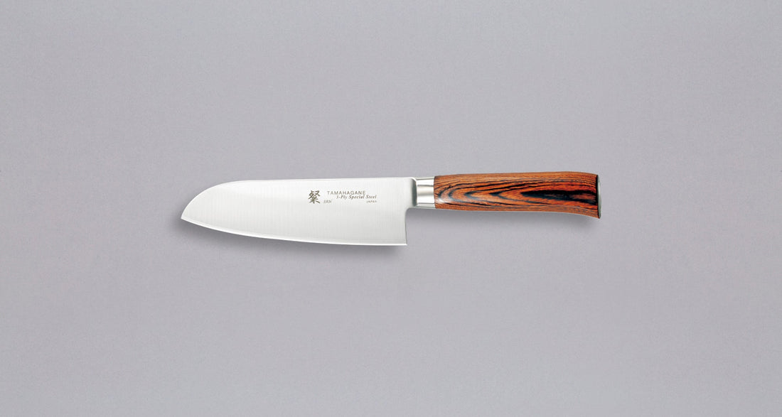 Tamahagane "SAN" Santoku 160mm (6.3")_1Tamahagane San Santoku in 160mm (6.3") blade length is a universal knife that will excel at a variety of cutting and chopping on a cutting board. A polished blade finish, featured with the core VG-5 steel hardened to 61 HRC.