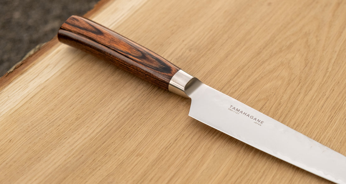 Tamahagane Petty knife is a must-have knife in every kitchen. It can be used for peeling, mincing, paring and decorating food. A matte blade finish, featured with the core VG-5 steel hardened to 61 HRC.