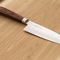 Tamahagane Tsubame Santoku is a universal knife that will excel at a variety of cutting and chopping on a cutting board. With its 120mm (4.7") blade length, it is considered a smaller santoku knife, suitable for those that prefer to work with shorter blades. A matte blade finish, featured with the core VG-5 steel hardened to 61 HRC.