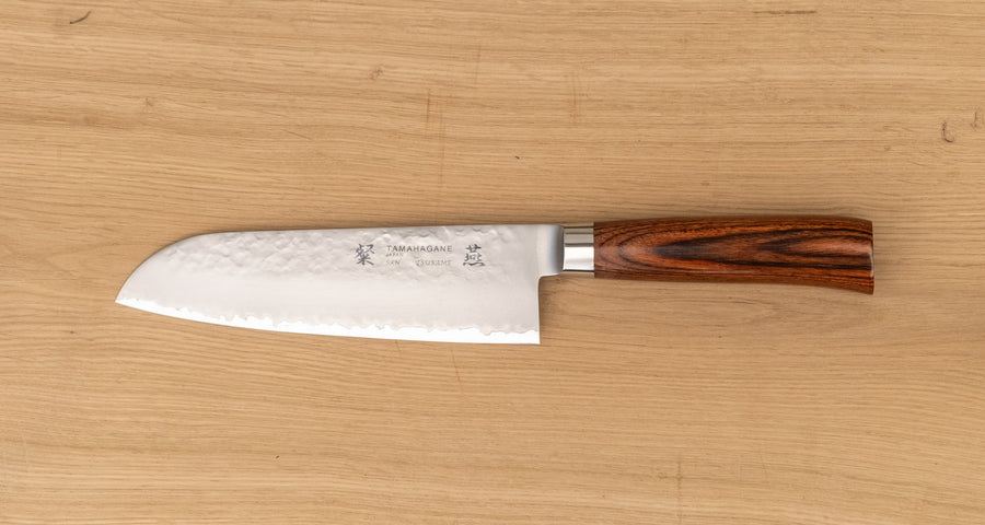 Tamahagane Tsubame Santoku in 175mm (6.9") blade length is a universal knife that will excel at a variety of cutting and chopping on a cutting board. A matte blade finish, featured with the core VG-5 steel hardened to 61 HRC.