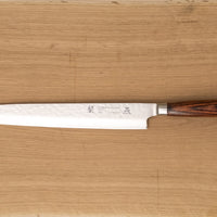 Tamahagane Tsubame Slicer knife is primarily intended for long pulls and precise cuts of meat and fish. The 210mm (8.3") version is the shortest of the slicers, designed for small to medium-sized fish and pieces of meat. A matte blade finish, featured with the core VG-5 steel hardened to 61 HRC.