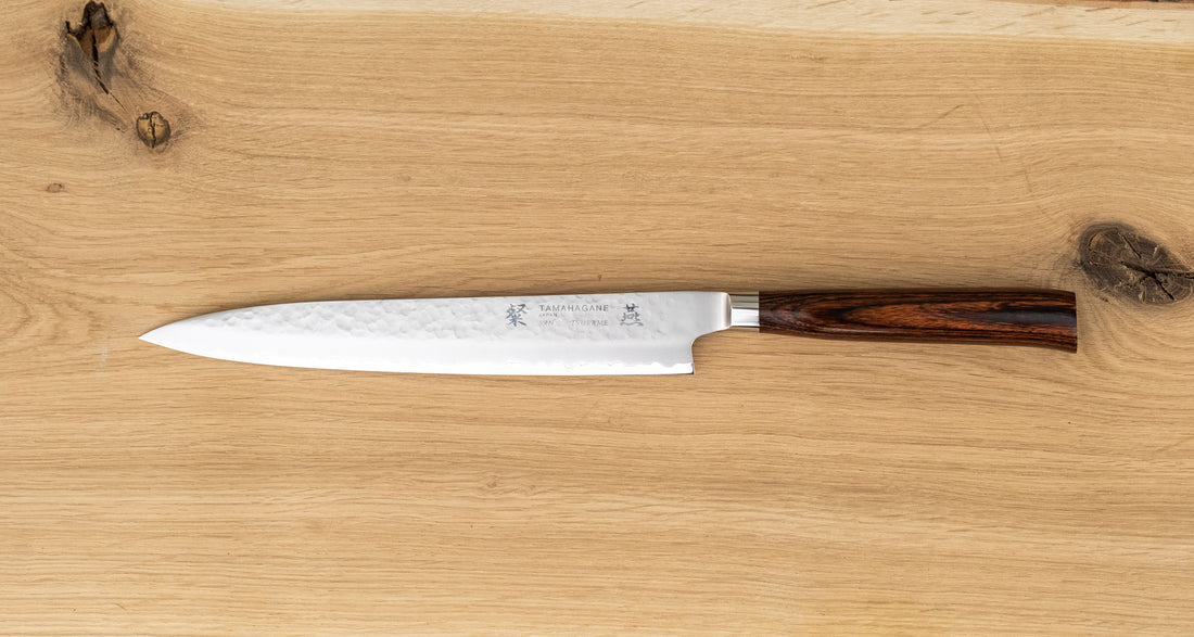 Tamahagane Tsubame Slicer knife is primarily intended for long pulls and precise cuts of meat and fish. The 240mm (9.5") version is designed for medium-sized fish and pieces of meat. A matte blade finish, featured with the core VG-5 steel hardened to 61 HRC.