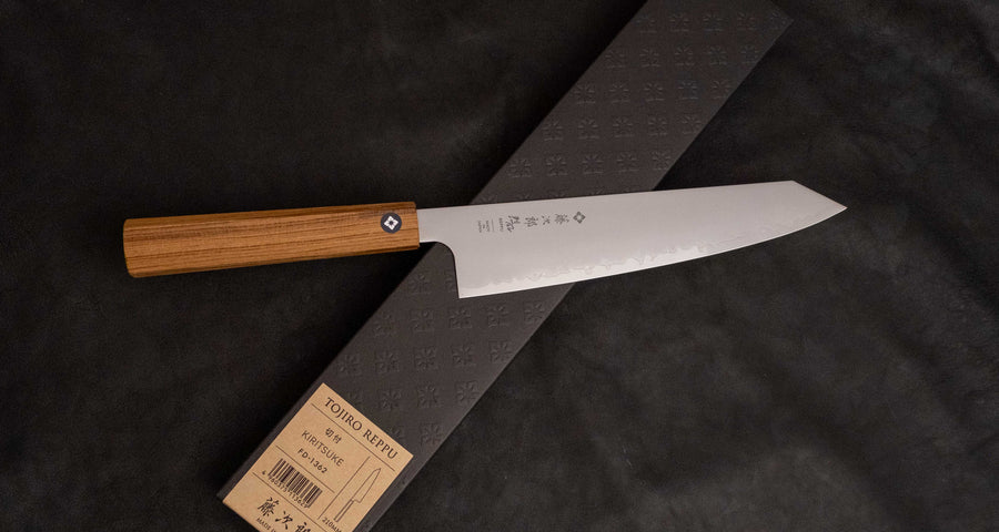 Tojiro Kiritsuke Gyuto Reppu SG2 210 mm knife with elegant migaki finish and rounded belly for versatile kitchen tasks.