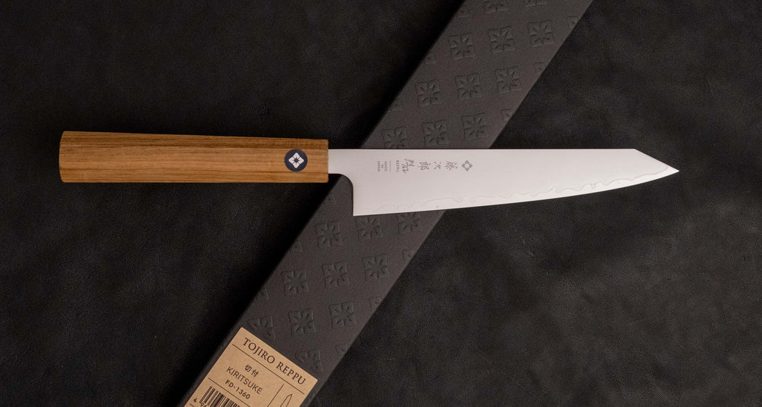 Tojiro Petty Reppu SG2 150 mm knife with SG2 powder steel core and a durable teak wood handle, ideal for precise kitchen tasks.