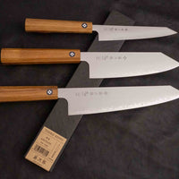 A premium set of Tojiro Kiritsuke Gyuto knives, featuring a selection of expertly crafted blades, including the SG2 core and elegant san mai finish, all housed in stylish wooden handles. Perfect for both home and professional chefs, offering precision, durability, and exceptional sharpness.