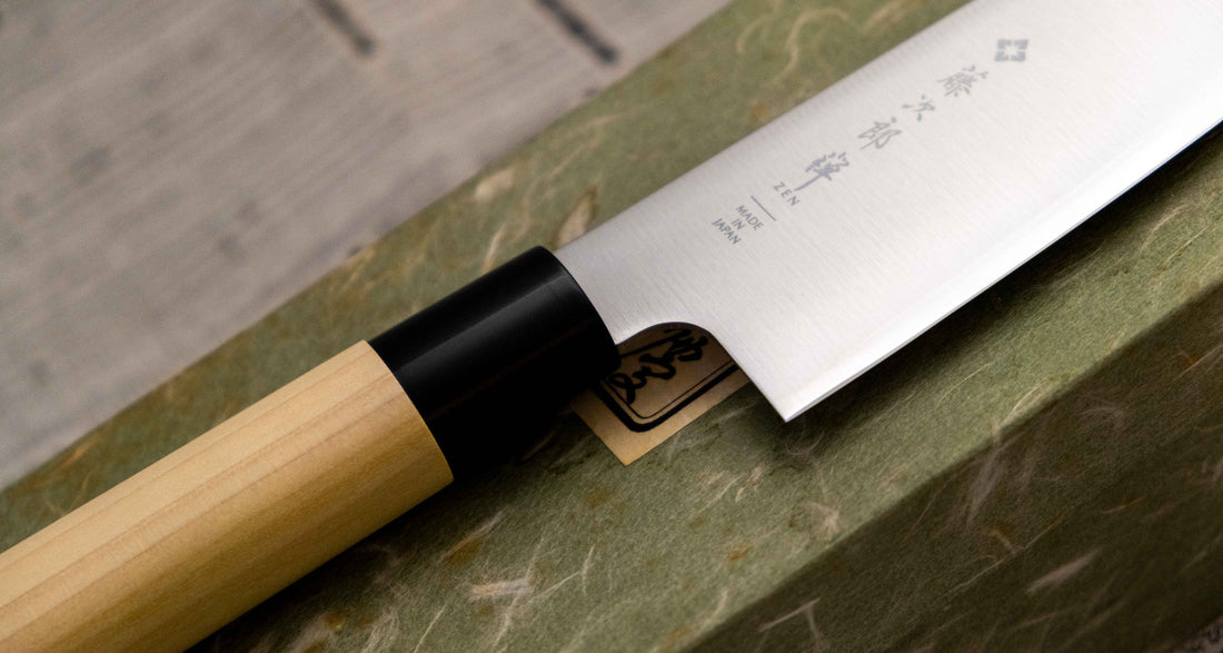 Tojiro Santoku Zen in 165mm is a great choice if you're looking for a handy, multi-purpose, low-maintenance knife that is very affordable. Stainless steel, traditional Japanese magnolia wood handle, minimalist blade finish - enjoy the classic Japanese aesthetic.