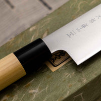 Tojiro Santoku Zen in 165mm is a great choice if you're looking for a handy, multi-purpose, low-maintenance knife that is very affordable. Stainless steel, traditional Japanese magnolia wood handle, minimalist blade finish - enjoy the classic Japanese aesthetic.