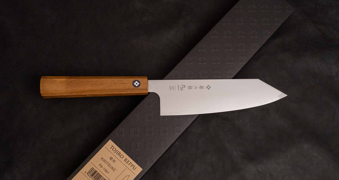 Tojiro Bunka Reppu SG2 170mm knife featuring a sleek SG2 powder steel blade and a teak wood Japanese handle, designed for versatile kitchen tasks.