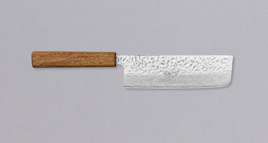 Tsunehisa Nakiri Damascus Tsuchime Oak 165mm (6.5"). Extreme sharpness will make this Tsunehisa Nakiri Oak a true kitchen slayer where no veggies will stand a chance. High performance steel, clean Japanese design, low maintenance and a price you don't have to break the bank to buy one makes this nakiri a real bargain.