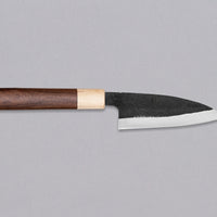 This Ajikiri SUJ-2 blade made by Yoshida Hamono is a Japanese knife for small fish. It's fitted with an oval rosewood handle which is topped with a cedar ferrule. The blade is forged from SUJ-2 steel with a hardness is 63-64 HRC, which holds its edge for a long time and is very easy to resharpen.