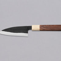 This Ajikiri SUJ-2 blade made by Yoshida Hamono is a Japanese knife for small fish. It's fitted with an octagonal rosewood handle which is topped with a cedar ferrule. The blade is forged from SUJ-2 steel with a hardness is 63-64 HRC, which holds its edge for a long time and is very easy to resharpen.