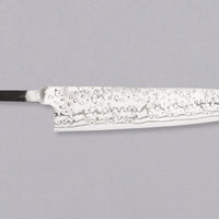 Yoishida Gyuto ZDP-189 damascus in 240mm length. The blade is made from the best powder steel, ZDP-189, so it's rust-resistant, low-maintenance, and keeps a super sharp edge for a very long time. At 240mm (9.4"), this gyuto is the perfect length for all cutting work in the kitchen, be it making steaks or chopping veg, as long as it is accompanied by a trusty petty for all those smaller, in-hand tasks.