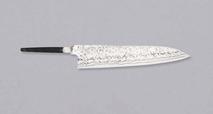 Yoishida Gyuto ZDP-189 damascus in 240mm length. The blade is made from the best powder steel, ZDP-189, so it's rust-resistant, low-maintenance, and keeps a super sharp edge for a very long time. At 240mm (9.4"), this gyuto is the perfect length for all cutting work in the kitchen, be it making steaks or chopping veg, as long as it is accompanied by a trusty petty for all those smaller, in-hand tasks.