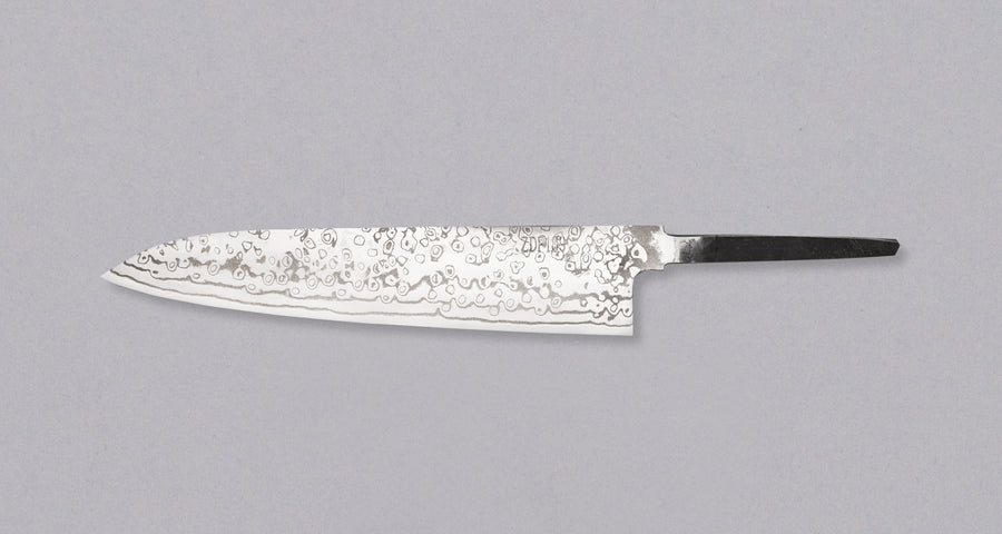 Yoishida Gyuto ZDP-189 damascus in 240mm length. The blade is made from the best powder steel, ZDP-189, so it's rust-resistant, low-maintenance, and keeps a super sharp edge for a very long time. At 240mm (9.4"), this gyuto is the perfect length for all cutting work in the kitchen, be it making steaks or chopping veg, as long as it is accompanied by a trusty petty for all those smaller, in-hand tasks.