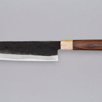 This Nakiri Kyusyu SUJ-2 blade is fitted with an oval rosewood handle, topped with a cedar ferrule. A traditional Japanese knife for cutting vegetables. The blade is forged from SUJ-2 steel with a hardness is 63-64 HRC, which holds its edge for a long time and is very easy to resharpen.