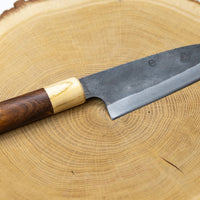 This Santoku Funayuki SUJ-2 blade is fitted with an oval rosewood handle with a cedar ferrule. Great for cutting smaller pieces of meat and filleting fish.  The blade is forged from SUJ-2 steel, which offers incredible capacities, hardness is 63-64 HRC, and at the same time, the knife is very easy to resharpen. 