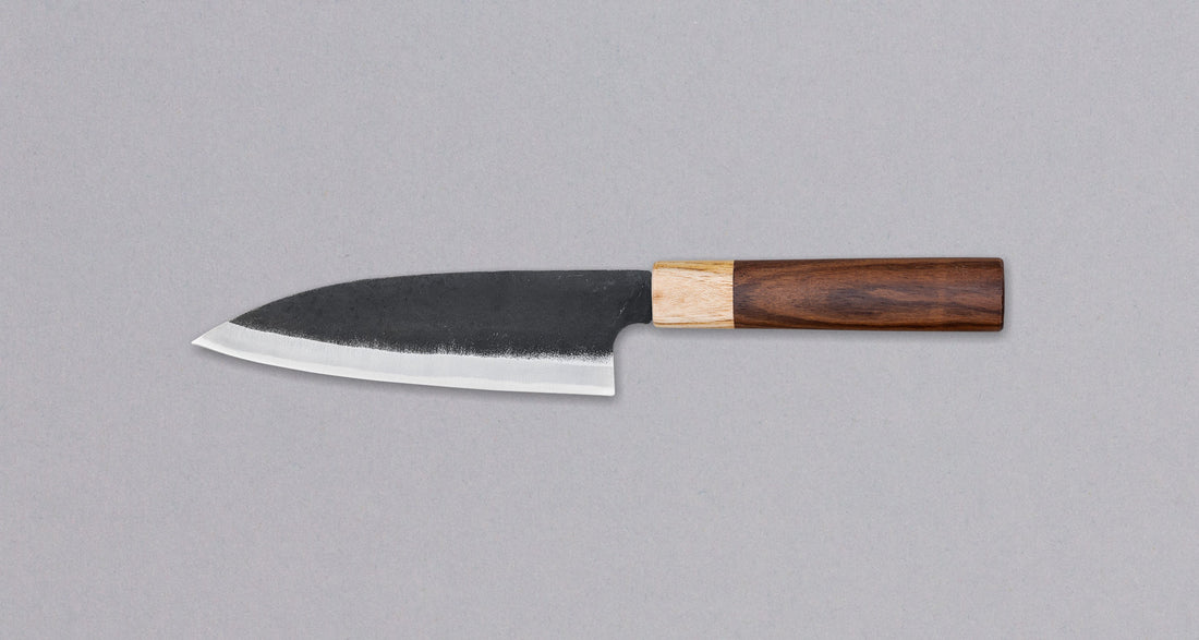 This Santoku Funayuki SUJ-2 blade is fitted with an oval rosewood handle with a cedar ferrule. Great for cutting smaller pieces of meat and filleting fish.  The blade is forged from SUJ-2 steel, which offers incredible capacities, hardness is 63-64 HRC, and at the same time, the knife is very easy to resharpen. 