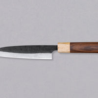 Yoshida Utility SUJ-2 Kuro-uchi is versatile and can be used both as a main multi-purpose knife, as well as a knife for smaller tasks. The blade is forged from SUJ-2 steel, which offers impressive capabilities. With a hardness of 63-64 HRC, it stays sharp for a very long time, but at the same time is easy to resharpen.