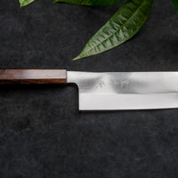 Kurosaki Nakiri Gekko from the Gekko line is the work of a talented master blacksmith Yu Kurosaki. The minimalistic, lightweight, perfectly balanced blade is treated to a high polish. The knife features new VG-XEOS steel (61 HRC), which has excellent resistance to wear and corrosion, and is fitted with an oak handle.