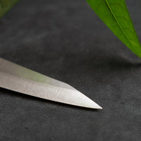 Kurosaki Petty from the Gekko line is another special blade from the hands of a talented young master blacksmith Yu Kurosaki. The minimalistic blade is treated to a high polish − hence the name Gekkō (月光), moonlight in Japanese. Made from VG-XEOS steel (61 HRC), it has excellent resistance to wear and corrosion.