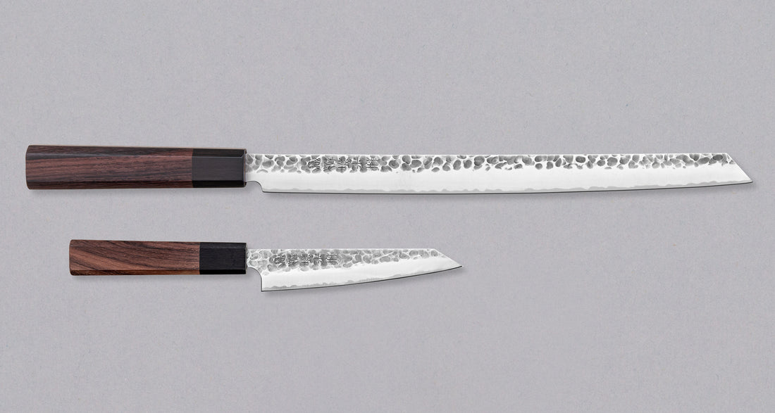 Great set for meat lovers! ZDP-189 Burja is the first Japanese-made prosciutto knife. Designed by SharpEdge, forged by Japanese smithy Suncraft, based in the famous blacksmith town of Seki, optimized for cutting prosciutto. ZDP-189 Petty complements it, taking care of all smaller cutting tasks the burja is too big for.