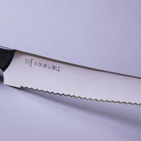 Micarta Pankiri (Bread Knife) 270mm (10.6")_2  A hand-forged Tojiro Micarta 270mm (10.6") bread knife with a compact black woods handle and a long blade (270 mm) is an indispensable tool for either professional chefs or passionate home cooks (sourdough enthusiasts, raise your hands!). The blade is made from Molybdenum Vanadium steel with 57–59 HRC.