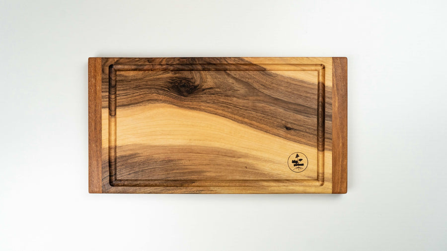 Steak cutting boards handcrafted in Slovenia, made from walnut wood (Juglans regia), known for its strength and durability. This small cutting board is just the right size to fit onto any countertop and is especially useful when we have a limited working surface. Due to its striking look, it can double as a serving board.