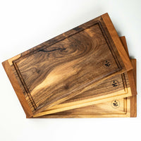Steak cutting boards handcrafted in Slovenia, made from walnut wood (Juglans regia), known for its strength and durability. This small cutting board is just the right size to fit onto any countertop and is especially useful when we have a limited working surface. Due to its striking look, it can double as a serving board.