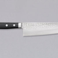 Etsu Village Damascus Santoku Black 170mm (6.7")_1  Damascus Santoku Black features a Western-style (Yo) handle from black micarta. This knife will be a great addition to your kitchen, suitable for cutting veggies, meat and fish. Blacksmith Masutani is known as an incredibly good knife sharpener, and his knives are no different, featuring a very thin spine (around 1.8mm).