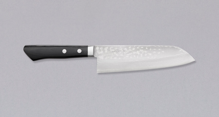 Etsu Village Damascus Santoku Black 170mm (6.7")_1  Damascus Santoku Black features a Western-style (Yo) handle from black micarta. This knife will be a great addition to your kitchen, suitable for cutting veggies, meat and fish. Blacksmith Masutani is known as an incredibly good knife sharpener, and his knives are no different, featuring a very thin spine (around 1.8mm).