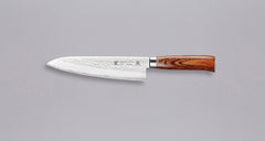 Tamahagane "TSUBAME" Gyuto 210mm (8.3")_1Tamahagane Gyuto is an all-rounder when it comes to knives, designed for a wide range of kitchen tasks. It will excel at chopping vegetables and slicing larger cuts of meat. The narrow tip can be used for tasks where precision is key. A true workhorse, that will ease long hours of food prep in a professional kitchen. The core of the blade has a high-polish finish and is forged out of VG-5 (High Carbon Molybdenum Vanadium Steel) steel hardened to 61 HRC. 