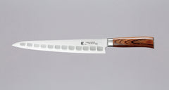 Tamahagane "SAN" Sujihiki (Fluted) 270mm (10.6")_1Tamahagane San Sujihiki (or slicer) knife is primarily intended for long pulls and precise cuts of meat and fish. Dimples on the blade also have a practical function: the air in the clefts acts as an anti-stick coating between the knife and the food and reduces the drag during cutting.