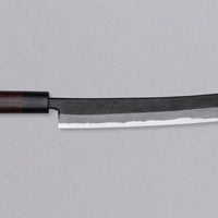 The Tsunehisa Sakimaru Sujihiki Aogami #2 270mm is a traditional Japanese knife used for preparing meat and fish, especially sashimi and nigiri sushi. The name sakimaru refers to the tanto tip, which is one of the main features of a katana. Made from Aogami #2 high-carbon steel, fitted with a rosewood japanese handle.